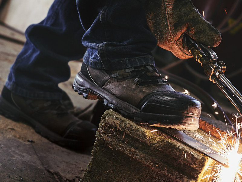 work boots for men, worker with torch wearing rocky xo-toe composite toe men's work boots